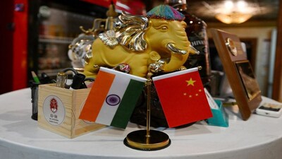 The national flags of India and China are seen on display at an Indian restaurant in Beijing. The last year saw a recalibration of India-China ties, partially owing to Donald Trump's actions. File image/AFP