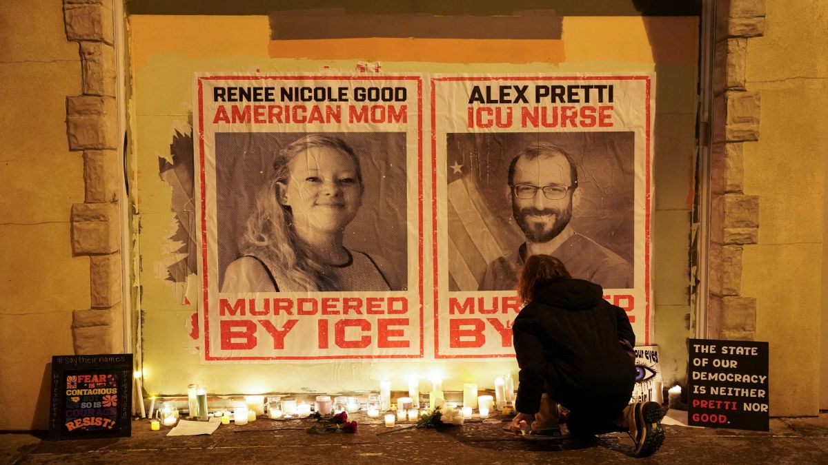 A person kneels near posters with images of Renee Nicole Good and Alex Pretti, after they were fatally shot in two separate incidents by federal immigration agents, following a vigil in Minneapolis, Minnesota. Reuters A person kneels near posters with images of Renee Nicole Good and Alex Pretti, after they were fatally shot in two separate incidents by federal immigration agents, following a vigil in Minneapolis, Minnesota. Reuters