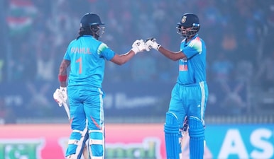India's KL Rahul, left, and batting partner Washington Sundar touch gloves during the first One Day International cricket match between India and New Zealand in Vadodara, India, Sunday, Jan. 11, 2026. AP