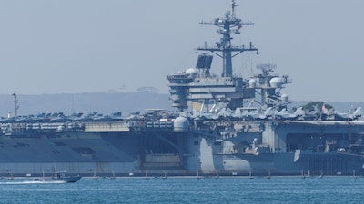 The US is stoking fears of a wider conflict West Asia by redirecting the aircraft carrier USS Abraham Lincoln Carrier Strike Group. File image/Reuters