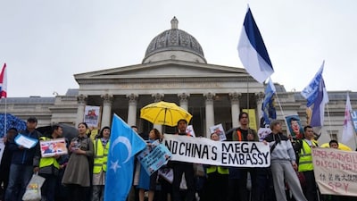 Protesters hold umbrellas, placards, and flags as they demonstrate against the proposed building of a new Chinese embassy, and to mark the 11th year of the Umbrella Revolution in Hong Kong, in London, UK, September 28, 2025. File Image/AP