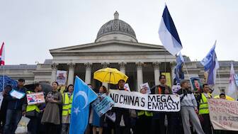 Protesters hold umbrellas, placards, and flags as they demonstrate against the proposed building of a new Chinese embassy, and to mark the 11th year of the Umbrella Revolution in Hong Kong, in London, UK, September 28, 2025. File Image/AP