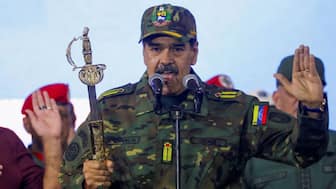  Venezuela's President Nicolas Maduro holds Simon Bolivar's sword as he addresses members of the armed forces, Bolivarian Militia, police, and civilians during a rally against a possible escalation of US actions toward the country, at Fort Tiuna military base in Caracas, Venezuela, on November 25, 2025. The US has captured Maduro, who has been indicted in New York on drugs and weapons charges. Reuters 