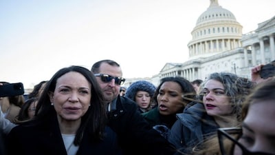 Venezuelan opposition leader Maria Corina Machado is surrounded by press as she departs the US Capitol after meeting with US senators. She also met with US President Donald Trump during which she presented the Nobel Peace Prize to him. AFP