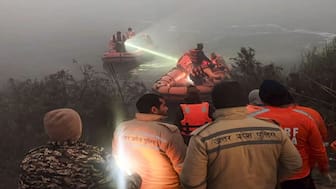 Police and State Disaster Response Force (SDRF) personnel conduct a search operation after Yuvraj Mehta, the 27-year-old software engineer, died after his car went out of control and fell into a 20-feet-deep water-filled pit that was dug for the basement of an under-construction building, in Noida. PTI