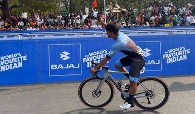 A rider from Team Rauland waves at the crowd during practice ahead of Stage 3. Image: Vishal Tiwari/Firstpost