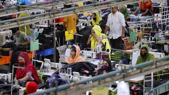 Bangladeshi garment workers make clothing in the sewing section of a factory in Gazipur, Bangladesh, April 9, 2025. File Photo/Reuters