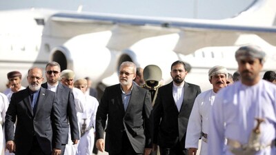 Secretary of the National Security Council, Ali Larijani is welcomed by the Minister of the Royal Office in the Sultanate of Oman, Sultan bin Mohammed al Numani, upon his arrival in Muscat, Oman, February 10, 2026. Reuters