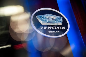 FILE PHOTO: The Pentagon logo is seen behind the podium in the briefing room at the Pentagon in Arlington, Virginia, U.S., January 8, 2020. REUTERS/Al Drago/File Photo