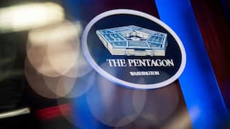 FILE PHOTO: The Pentagon logo is seen behind the podium in the briefing room at the Pentagon in Arlington, Virginia, U.S., January 8, 2020. REUTERS/Al Drago/File Photo