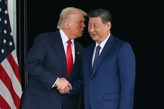 US President Donald Trump (left) shake hands with his Chinese counterpart Xi Jinping. File image/AFP