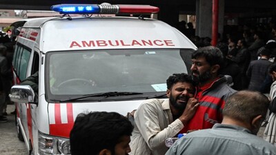 People mourn the death of their relatives following a suicide bombing at a Shiite mosque, outside a hospital in Islamabad on February 6, 2026. AFP