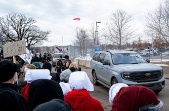 MINNEAPOLIS, MINNESOTA - FEBRUARY 7: People throw sex toys at a vehicle driven by federal agents outside the Bishop Henry Whipple Federal Building on February 7, 2026 in Minneapolis, Minnesota. Today marks one month since Renee Good, a mother of three, was shot and killed by federal agents. Protests continue calling for an end to immigration raids in the Twin cities which have already resulted in the fatal shooting deaths of Good and Alex Pretti, a VA nurse.  Stephen Maturen/Getty Images/AFP (Photo by Stephen Maturen / GETTY IMAGES NORTH AMERICA / Getty Images via AFP)
