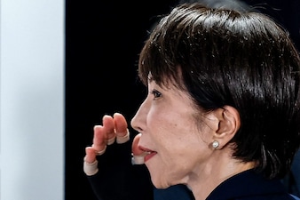 Japan's Prime Minister and President of the Liberal Democratic Party (LDP), Sanae Takaichi, gestures after speaking with media on the House of Representatives election day at the LDP headquarters in Tokyo on February 8, 2026. (Photo by Kim Kyung-Hoon / POOL / AFP) 