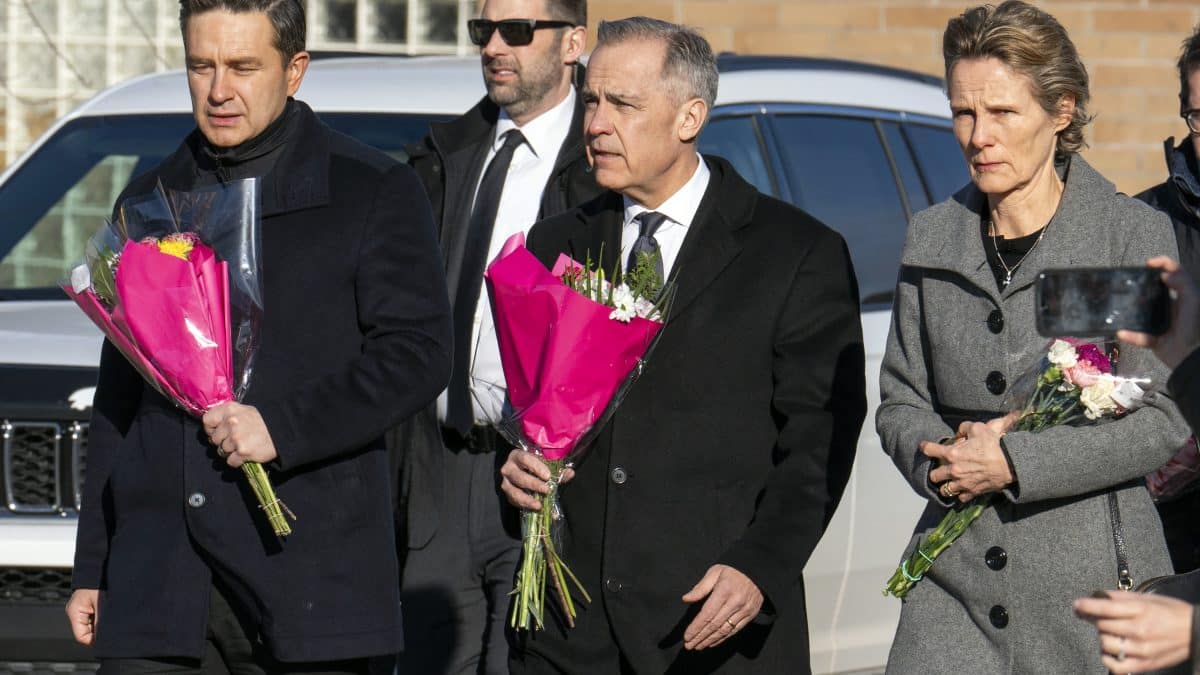 PM Carney lays flowers in Tumbler Ridge as Canada mourns shooting while new details emerge â Firstpost