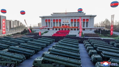 This picture taken on February 18, 2026 and released by North Korea's official Korean Central News Agency (KCNA) on February 19, 2026 shows a ceremony to unveil the new 600mm multiple launch rocket system in front of the April 25th Cultural Center in Pyongyang. AFP