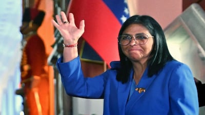 Venezuela's interim president Delcy Rodriguez waves after signing the amnesty law approved by the National Assembly at the Miraflores Palace in Caracas on February 19, 2026. AFP