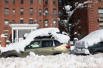 Cars are seen buried under snow on Lincoln Avenue on February 24, 2026 in the Prospect Lefferts Gardens neighborhood of the Brooklyn borough in New York City. The snowstorm delivered up to 24 inches of snow to parts of New York City, canceled flights, disrupted transit, and downed power lines. Mayor Zohran Mamdani gave public schools a rare snow day on Monday in what was one of the largest snowstorms to hit the area in recent history.   Michael M. Santiago/Getty Images/AFP (Photo by Michael M. Santiago / GETTY IMAGES NORTH AMERICA / Getty Images via AFP)