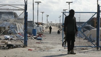 Members of the Syrian government forces stand at the empty Al-Hol camp, closed by the Syrian authorities in the northeastern Hasakeh governorate on February 25, 2026. AFP