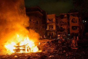 Firefighters work to extinguish a blaze after a missile launched from Iran struck Tel Aviv, Israel. File image/AP