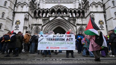 People protest outside the High Court as judges prepare to rule on a legal challenge to the British government’s decision to designate pro‑Palestinian group Palestine Action as a terrorist organisation, in London, Britain, on Friday. Reuters