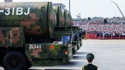 A member of the People's Liberation Army stands as the strategic strike group displays DF-31BJ nuclear missiles during a military parade to mark the 80th anniversary of the end of World War Two, in Beijing, China, September 3, 2025. File Image/Reuters