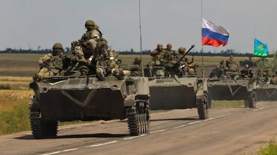An armoured convoy of Russian troops drives in Russian-occupied part of Ukraine's Zaporizhzhia region on July 23, 2022. (Photo: Alexander Ermochenko/Reuters)