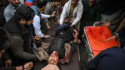 People shift an injured man to a hospital following an explosion at a mosque in Islamabad, Pakistan, on February 6, 2026. (Photo: Aamir Qureshi/AFP) 
