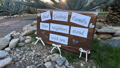 Neighbours of Nancy Guthrie, the daughter of "Today" host Savannah Guthrie, show support for the family in metro Tucson, Arizona, on February 3, 2026, as the search continues to find Nancy who was reported missing. File Image/AP