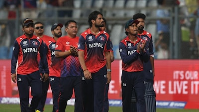 Members of the Nepal cricket team and support staff perform a lap of honour around Mumbai's Wankhede Stadium after nearly defeating two-time T20 world champions England. Reuters