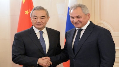Russian Security Council's Secretary Sergei Shoigu shakes hands with China's Foreign Minister Wang Yi during the Meeting of BRICS high-ranking security officials, in Saint Petersburg, Russia , on September 10, 2024. Reuters File
