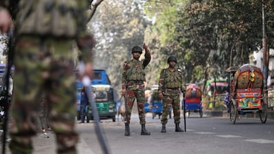 Army soldiers patrol on a street as a part of heightened security measures leading up to Thursday's parliamentary national election, in Dhaka, Bangladesh, Wednesday, Feb. 11, 2026. (AP Photo/Mahmud Hossain Opu)
