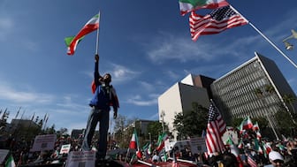 Demonstrators take part in a march in support of the people of Iran by members of the American-Iranian community in Los Angeles on February 14, 2026.- AFP