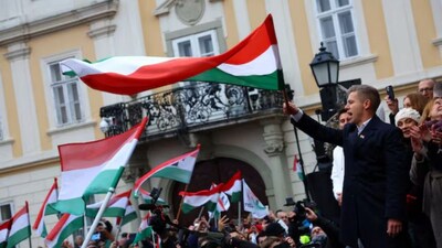 Peter Magyar, leader of the opposition TISZA party, waves a flag during a campaign tour in Gyor, Hungary, November 15, 2025.- Reuters