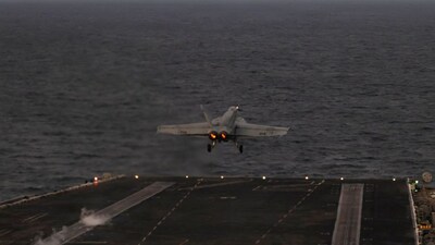 In this handout photograph released by the US Navy on February 5, 2026, an F/A-18E Super Hornet, attached to Strike Fighter Squadron (VFA) 14, launches from the flight deck of Nimitz-class aircraft carrier USS Abraham Lincoln in the Arabian Sea on February 3, 2026.- AFP