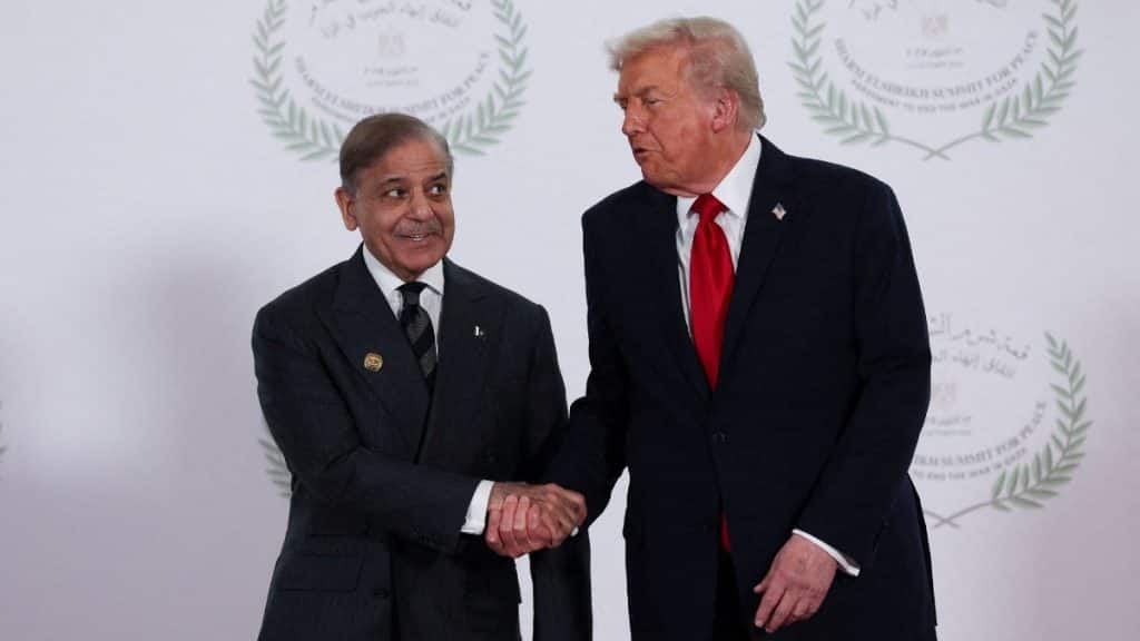 US President Donald Trump and Pakistani Prime Minister Shehbaz Sharif shake hands as they pose for a photo, at a world leaders' summit on ending the Gaza war, amid a US-brokered prisoner-hostage swap and ceasefire deal between Israel and Hamas, in Sharm el-Sheikh, Egypt, October 13, 2025. File Image/Reuters