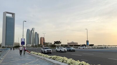 People walk on a promenade overlooking the skyline in Abu Dhabi, United Arab Emirates, January 23, 2026. Picture taken with a mobile phone. REUTERS