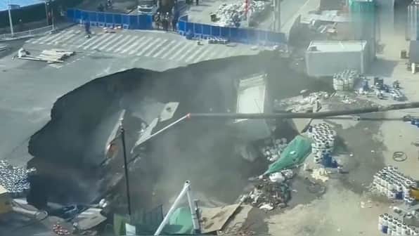 Shanghai sinkhole swallows roadway in sudden collapse | Watch ...