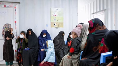 Afghan women and children wait for their turn to see a doctor at Yaka Dokan health clinic run by the nonprofit organisation World Vision in Yaka Dokan village, Herat, Afghanistan. (Reuters)

