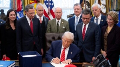US President Donald Trump signs a funding bill in the Oval Office of the White House in Washington, DC, on February 3, 2026. AFP