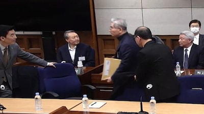 South Korea's former president Yoon Suk Yeol attends a sentencing trial on his insurrection charges at the Seoul Central District Court in Seoul. AFP