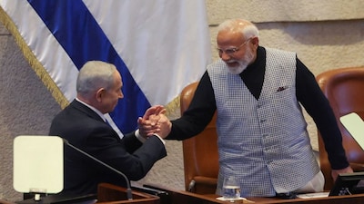 Israel's Prime Minister Benjamin Netanyahu greets Prime Minister Narendra Modi, during a special session of the Knesset, Israel's parliament, in Jerusalem on February 25. Reuters