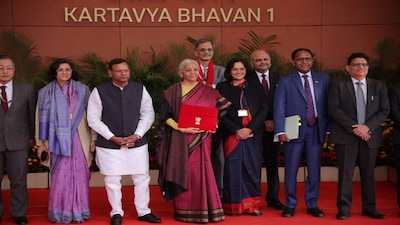 India's Finance Minister Nirmala Sitharaman holds a folder bearing the Government of India's emblem, as she poses with her officials while leaving her office to present the annual Budget in Parliament, in New Delhi, India. Reuters