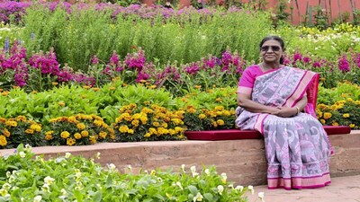 President Droupadi Murmu sits along the pretty blooms at Amrit Udyan in Rashtrapati Bhavan. PTI