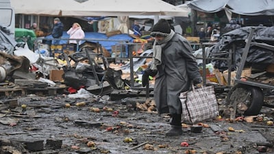 People walk at a ruined city market following a Russia's attack in Odesa, Ukraine. The Russia-Ukraine war is Europe’s biggest conflict since World War II. AP