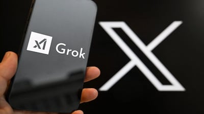 A smartphone bearing the logo of Grok, the generative artificial intelligence chatbot developed by US artificial intelligence company xAI in front of the X logo. The EU  hit Elon Musk's X with an investigation over AI chatbot Grok's generation of sexualised deepfake images of women and minors. File image/AFP