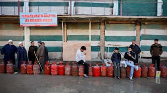 People wait in a queue with their empty LPG cylinders outside a gas agency amid supply disruptions following the US-Israeli conflict with Iran, in Magam town, Kashmir, March 13, 2026. Reuters