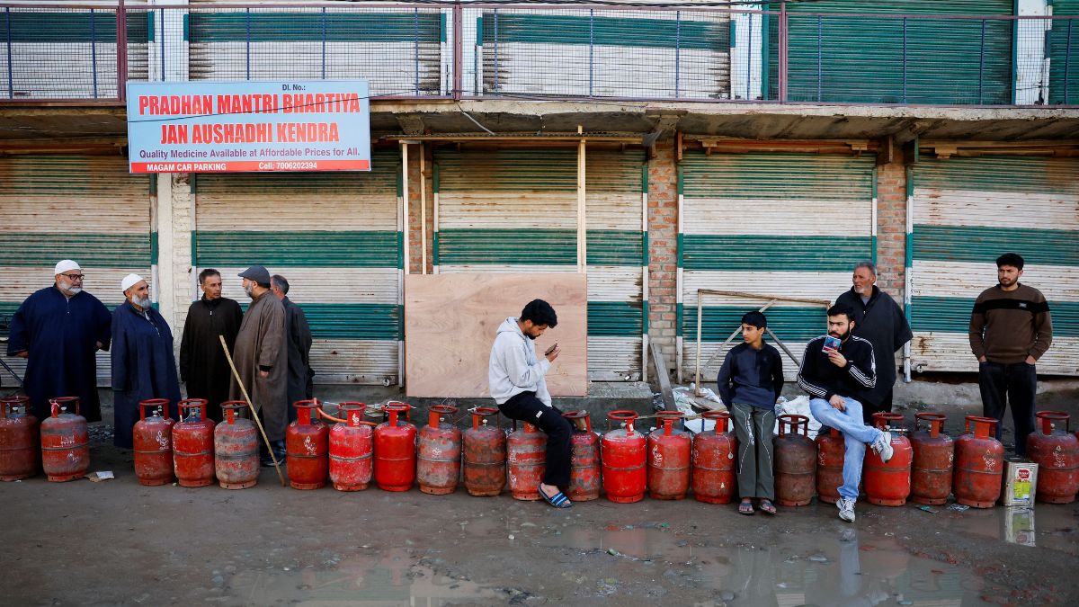 People wait in a queue with their empty LPG cylinders outside a gas agency amid supply disruptions following the US-Israeli conflict with Iran, in Magam town, Kashmir, March 13, 2026. Reuters People wait in a queue with their empty LPG cylinders outside a gas agency amid supply disruptions following the US-Israeli conflict with Iran, in Magam town, Kashmir, March 13, 2026. Reuters