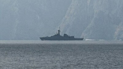 A navy vessel is seen sailing in the Strait of Hormuz, a vital waterway through which much of the world's oil and gas passes on March 1, 2026. AFP
