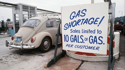 Sign reading "Gas shortage! Sales limited to 10 gallons of gas per customer" posted at a Connecticut filling station during the 1970s energy crisis which impacted the United States as well. Image credit: Corbis Historical